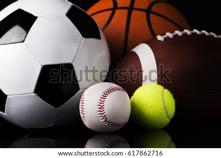 sport balls isolated on black background