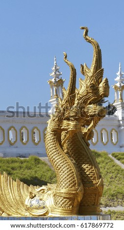 Beautiful golden naga in Temple of Thailand
