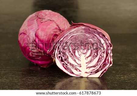 red cabbage on black wooden background
