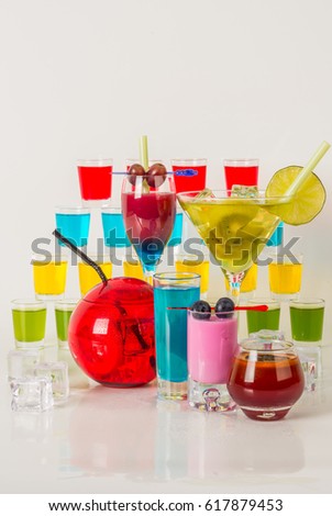 Colorful set of drinks, color drink decorated with fruit, many color kamikaze drink, shot drinks, party set