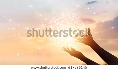 Abstract science, circle global network connection in hands on sunset background Royalty-Free Stock Photo #617896145