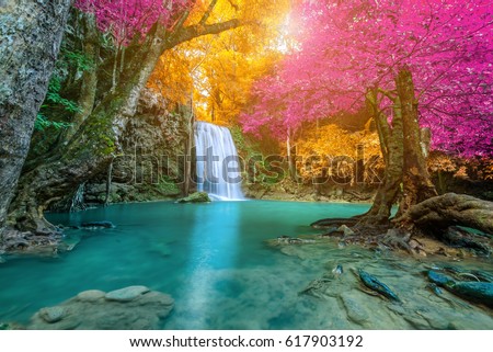 Amazing waterfall in colorful autumn forest 