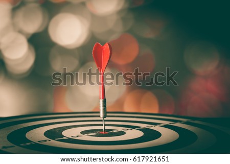 Bullseye is a target of business. Dart is an opportunity and Dartboard is the target and goal. So both of that represent a challenge in business marketing as concept. Royalty-Free Stock Photo #617921651