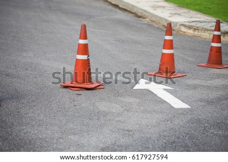 Orange cone on the street