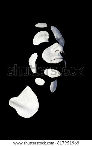 Creative makeup. Conceptual idea of bold body art painting. Abstract picture with white spots on black background on male face.