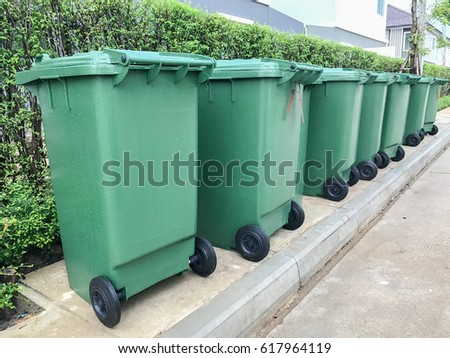 row of green plastic bin Royalty-Free Stock Photo #617964119