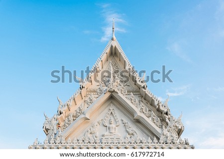 Thia temple with white roof and blue sky.