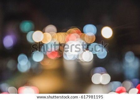 Blurred Defocused Multi Color Lights. Traffic in a City Streets. Toned in Dark Pastel Colors. Abstract Background