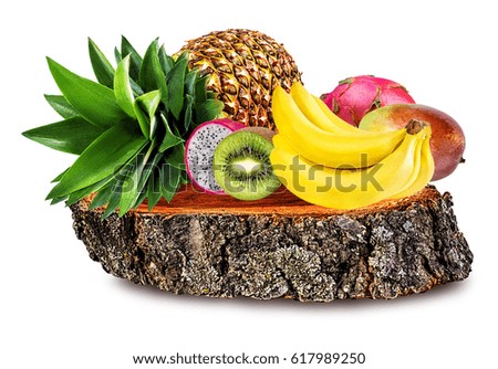 
Collection of fruits on a tree stump isolated on white background