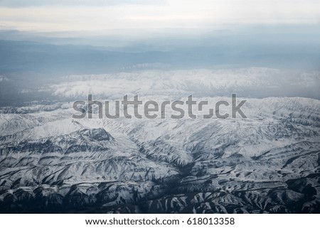 Aerial view from air plane of snow mountains