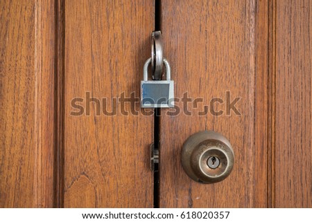 Master key lock on wooden door with knob