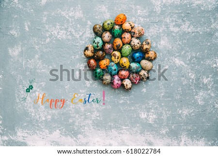 Happy Easter text on vintage background with colourful eggs 