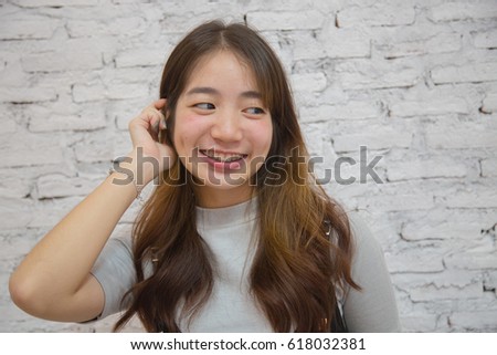 Young friendly Asian woman with smiley face, Asian girl smiles cute 