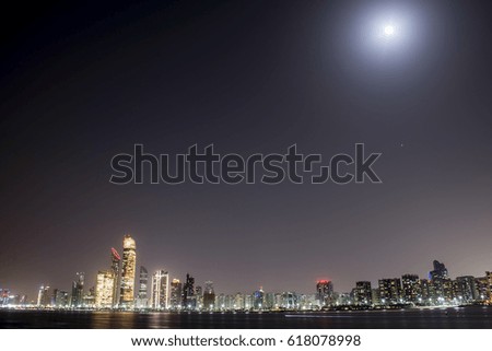 Abu Dhabi Skyline In Night under Full Moon