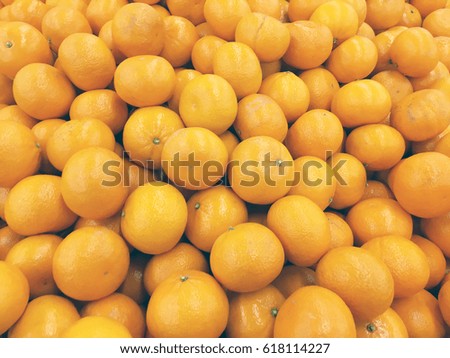 Tangerines harvest. Many tangerines. Tangerines texture. 