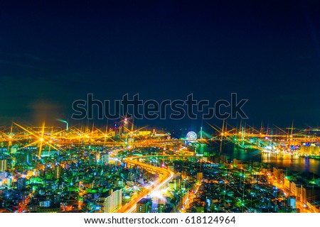 The image of the night city from the height of a bird's flight.A view of the night Osaka.Mnogo houses in iluminatsii.Dark time of the day