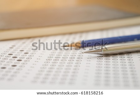 close up soft focus on Clutch-type pencil lay on exam sheet paper test paper:blur picture concept.