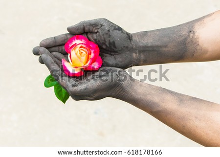 dark hands gardening people with roses Royalty-Free Stock Photo #618178166