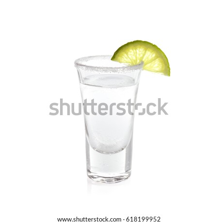 Tequila shot with juicy lime slice and salt on white background Royalty-Free Stock Photo #618199952
