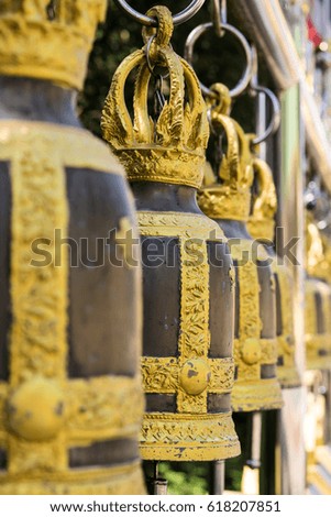 Buddhist bells inside the temple. Vertical shot.