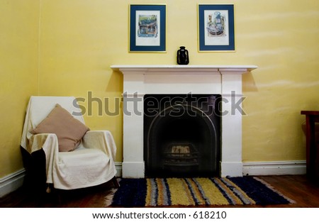 Interior of living room with wooden floors and fireplace