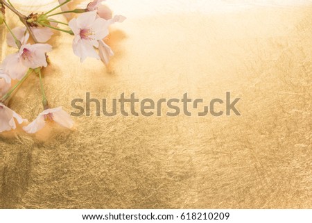 Cherry blossoms and gold paper background