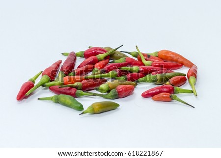 Red & green chilly pepper on white background.The chili pepper is the fruit of plants from the genus Capsicum, members of the nightshade family, Solanaceae. 