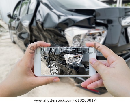 Car crash accident damaged with hand using smartphone taking photo