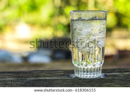 cold water with ice in a glass