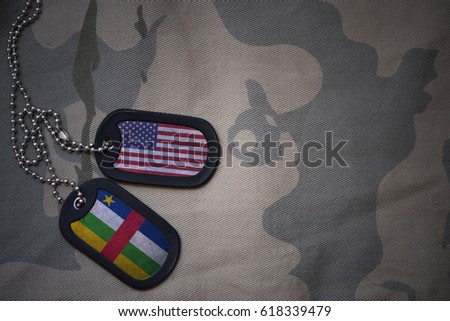 army blank, dog tag with flag of united states of america and central african republic on the khaki texture background. military concept