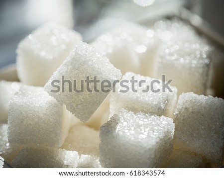 Close up shot of white refinery sugar. Royalty-Free Stock Photo #618343574