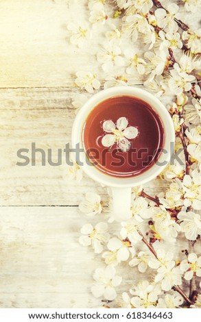 Spring background, flowers and tea. Selective focus.