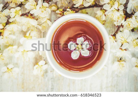 Spring background, flowers and tea. Selective focus.
