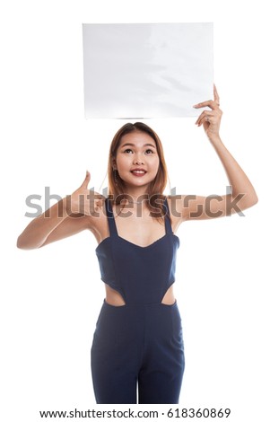 Young Asian woman show thumbs up with white blank sign isolated on white background