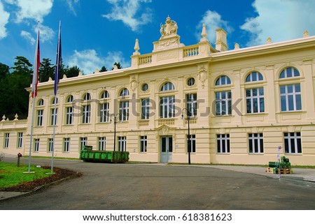 Main historical building and residence of Biliner mineral water  with czech legend "Bilinska kyselka" in Biliner Spa complex.  Royalty-Free Stock Photo #618381623