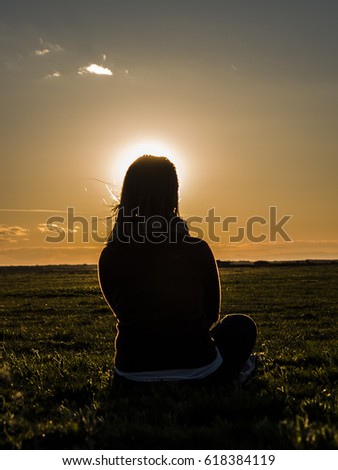 Woman watching the sunset 