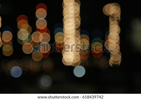 image of blurred bokeh background with warm colorful lights. Abstract circular bokeh background of festival Christmas light