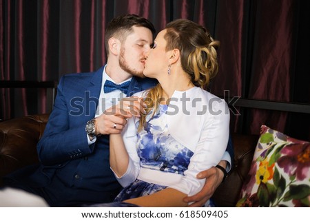 wedding in interior. Newlyweds kissing. Wedding photo shoot