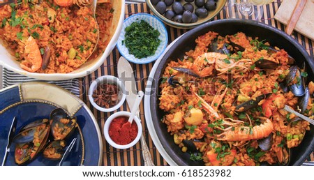 Top down view of delicious Spanish seafood paella: mussels, king prawns, langoustine, haddock Royalty-Free Stock Photo #618523982