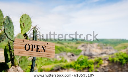 Close up of a beautiful view of Broken Bay cave with a sign and an inscription "Open". Horizontal shot. Nusa Penida, Indonesia.