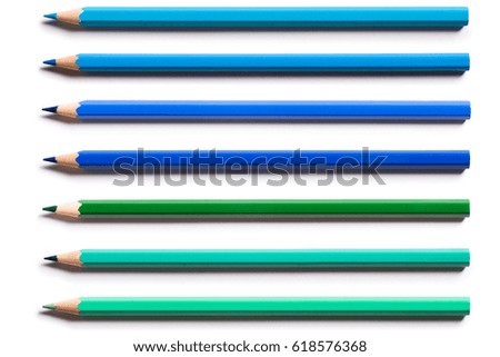 Blue,turquoise,green pencils isolated on white background.