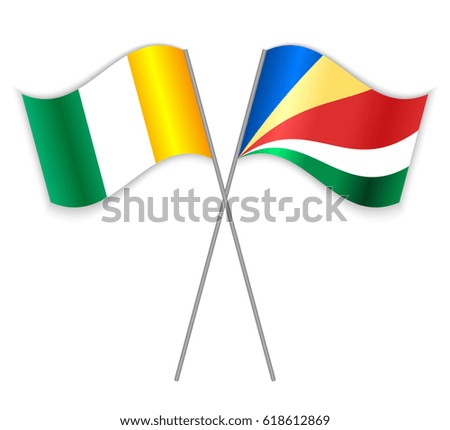 Ivorian and Seychellois crossed flags. Ivory Coast combined with Seychelles isolated on white. Language learning, international business or travel concept.