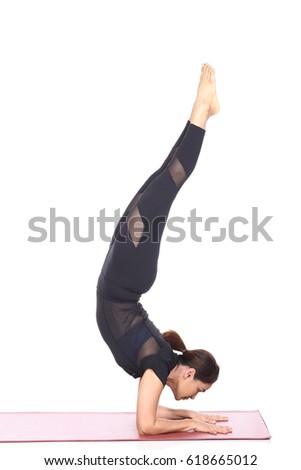 Asian Woman Yoga Teacher Instructor demonstrate each pose of lesson on matte, black dress suite leotard fashion legging, full length, studio lighting white background isolated
