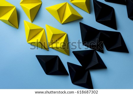 Origami two dimension shapes in yellow and black colors with free copy space . Great for using in web.
