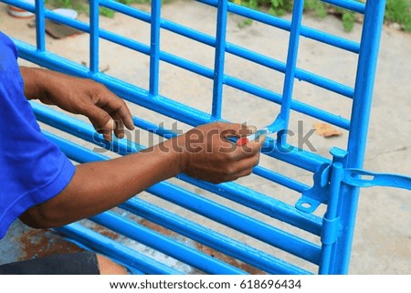 Men painted steel fence