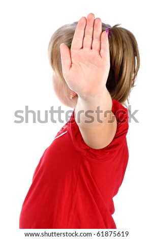 Small girl shows denial with her hand isolated on white