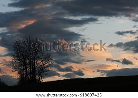 A sunset with bright and dark clouds
