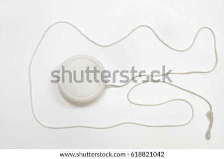 yoyo white plastic toy with unwound thread