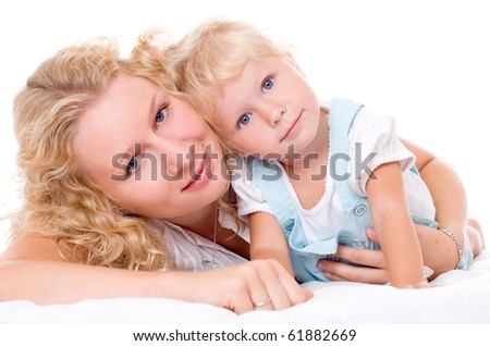 Beautiful, young mum and her daughter with blonde hair, isolated