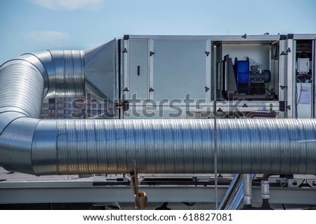 Gray Air Handling Unit for the central ventilation system on the roof of the mall Royalty-Free Stock Photo #618827081
